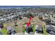 Aerial view showing a two-story house in a residential neighborhood at 4179 Bramblewood Loop, Spring Hill, FL 34609