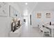 Bright and airy entryway with decorative console table and mirrors at 4179 Bramblewood Loop, Spring Hill, FL 34609