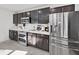 Modern kitchen with stainless steel appliances and white subway tile backsplash at 4179 Bramblewood Loop, Spring Hill, FL 34609