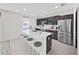 Modern kitchen with white quartz countertops and stainless steel appliances at 4179 Bramblewood Loop, Spring Hill, FL 34609