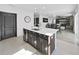 Kitchen island with white quartz countertop and stainless steel appliances at 4179 Bramblewood Loop, Spring Hill, FL 34609