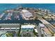 Wide aerial showcasing the building and marina views at 423 S Paula Dr # 203, Dunedin, FL 34698