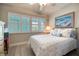 Bedroom with a queen-size bed and coastal decor at 423 S Paula Dr # 203, Dunedin, FL 34698