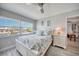 Main bedroom with water views and en suite bath at 423 S Paula Dr # 203, Dunedin, FL 34698