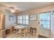 Bright dining area with table and chairs, near kitchen at 423 S Paula Dr # 203, Dunedin, FL 34698