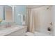 Updated bathroom with a tub, shower, and modern vanity at 443 Pinellas Bayway S # 104, St Petersburg, FL 33715