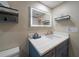 Modern bathroom with blue vanity, white countertop, and glass shower at 4550 Overlook Ne Dr # 257, St Petersburg, FL 33703