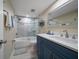 Updated bathroom with a walk-in shower and blue vanity at 4550 Overlook Ne Dr # 257, St Petersburg, FL 33703