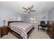 Spacious bedroom with king-size bed, dresser, and ceiling fan at 4550 Overlook Ne Dr # 257, St Petersburg, FL 33703