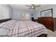 Large bedroom with king-size bed, dresser, and ceiling fan at 4550 Overlook Ne Dr # 257, St Petersburg, FL 33703