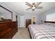 Bright bedroom with king bed, dresser, and access to bathroom at 4550 Overlook Ne Dr # 257, St Petersburg, FL 33703