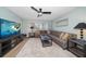 Living area with large TV and comfortable sectional sofa at 4550 Overlook Ne Dr # 257, St Petersburg, FL 33703