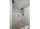 Walk-in shower with pebble floor and glass enclosure at 4550 Overlook Ne Dr # 257, St Petersburg, FL 33703