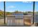 Stainless steel grill, sink, and refrigerator are featured in this outdoor kitchen at 460 87Th Avenue North, St Petersburg, FL 33702