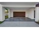 Covered parking spot with wood-like garage door at 484 87Th Avenue North, St Petersburg, FL 33702