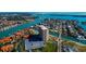 Aerial view of waterfront community, featuring a tall residential building, pool, and boat slips at 4900 Brittany S Dr # 608, St Petersburg, FL 33715