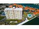 Aerial view of a high-rise condo building with pool and marina at 4900 Brittany S Dr # 608, St Petersburg, FL 33715