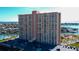 Aerial view of high-rise building near waterfront with parking and pool at 4900 Brittany S Dr # 608, St Petersburg, FL 33715