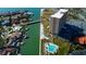 High-rise residential building near the water with a pool and parking at 4900 Brittany S Dr # 608, St Petersburg, FL 33715