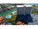 High-rise building, pool, and parking lot, situated in a waterfront community at 4900 Brittany S Dr # 608, St Petersburg, FL 33715