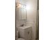 A bathroom vanity with a sink, storage and a mirror cabinet with lights at 5209 10Th S Ave, Gulfport, FL 33707