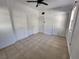 Tile flooring and fan in bedroom with natural light and closet at 5209 10Th S Ave, Gulfport, FL 33707