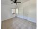 Bright bedroom with tiled floors, a window, and ceiling fan at 5209 10Th S Ave, Gulfport, FL 33707