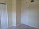 A hallway that connects to a room with two white doors at 5209 10Th S Ave, Gulfport, FL 33707