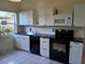 Kitchen view showcasing stainless steel appliances, tile floor, cabinets and counterspace at 5209 10Th S Ave, Gulfport, FL 33707