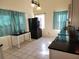 View of kitchen with stainless steel appliances, tile floor, and natural light at 5209 10Th S Ave, Gulfport, FL 33707