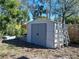 White storage shed with double doors in backyard at 5209 10Th S Ave, Gulfport, FL 33707