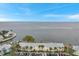 Aerial view showcasing waterfront property, with clear water views and building details at 5258 Beach Se Dr, St Petersburg, FL 33705