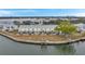 Aerial view of waterfront community with multiple buildings, parking, and boat docks at 5258 Beach Se Dr, St Petersburg, FL 33705