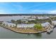 Aerial view of waterfront townhomes with lush landscaping and water access at 5258 Beach Se Dr, St Petersburg, FL 33705