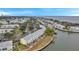 Aerial view of waterfront community with multiple buildings and boat docks at 5258 Beach Se Dr, St Petersburg, FL 33705