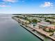 Aerial view of waterfront community with pool, dock, and clubhouse at 5258 Beach Se Dr, St Petersburg, FL 33705