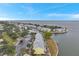 Aerial view of waterfront property, showcasing community layout and boat docks at 5258 Beach Se Dr, St Petersburg, FL 33705