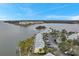 Aerial perspective of waterfront community, highlighting building layout and parking at 5258 Beach Se Dr, St Petersburg, FL 33705