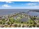 Aerial view of community with lakes, tennis courts, and lush landscaping at 5258 Beach Se Dr, St Petersburg, FL 33705