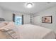 Spacious bedroom with large bed, window, and built-in shelving at 5258 Beach Se Dr, St Petersburg, FL 33705