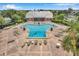 Community pool with lounge chairs at 5258 Beach Se Dr, St Petersburg, FL 33705