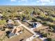 Aerial view of a residential area near a waterway, showcasing several homes at 5366 Hader Rd, North Port, FL 34288