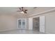 Bright bedroom with tile floors, ceiling fan and access to pool at 5366 Hader Rd, North Port, FL 34288