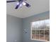 Bright bedroom with ceiling fan and large window at 5366 Hader Rd, North Port, FL 34288