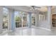 Dining room with large windows and light blue curtains at 5366 Hader Rd, North Port, FL 34288