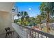 Private balcony overlooking lush tropical landscape at 5500 Gulf Blvd # 2240, St Pete Beach, FL 33706