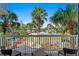 Balcony view of tropical landscaping and resort amenities at 5500 Gulf Blvd # 2240, St Pete Beach, FL 33706