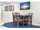 Small dining area with a table and four chairs at 5500 Gulf Blvd # 2240, St Pete Beach, FL 33706