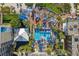 Aerial view of resort pool with surrounding lounge chairs and umbrellas at 5500 Gulf Blvd # 2240, St Pete Beach, FL 33706