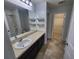 Bathroom with vanity, sink, toilet, and walk-in shower at 7041 Spotted Deer Pl, Riverview, FL 33569